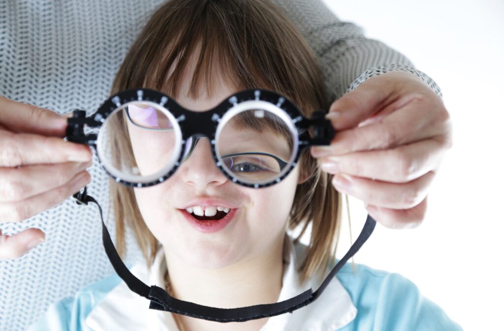 A young happy girl in an eye appointment.